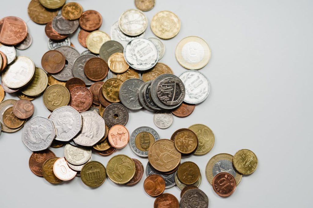 Round coins representing growth and development through reinvesting