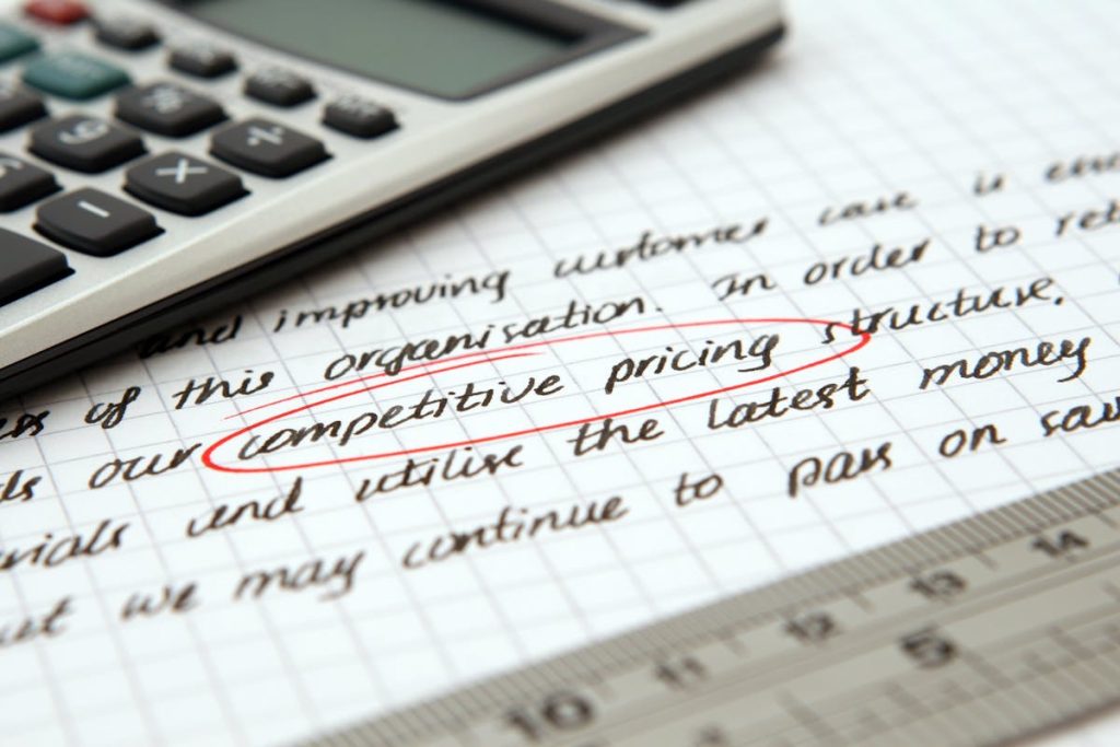 Competitive pricing is written on notebook