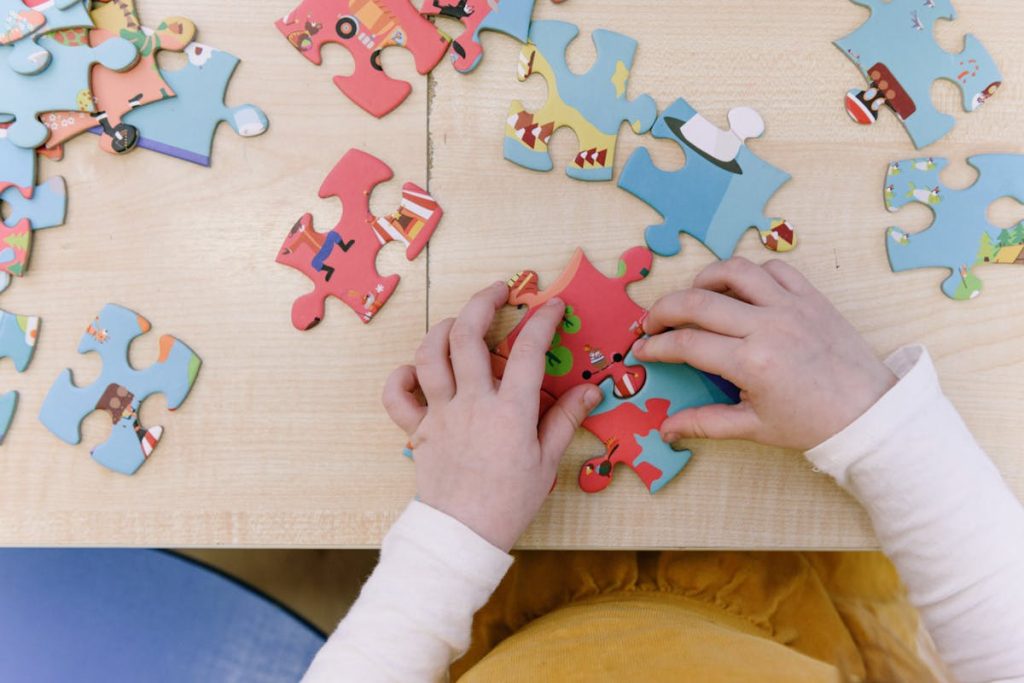 Hands working on a puzzle close-up, visualizing the methodical setup of a custom Invisible Funnel