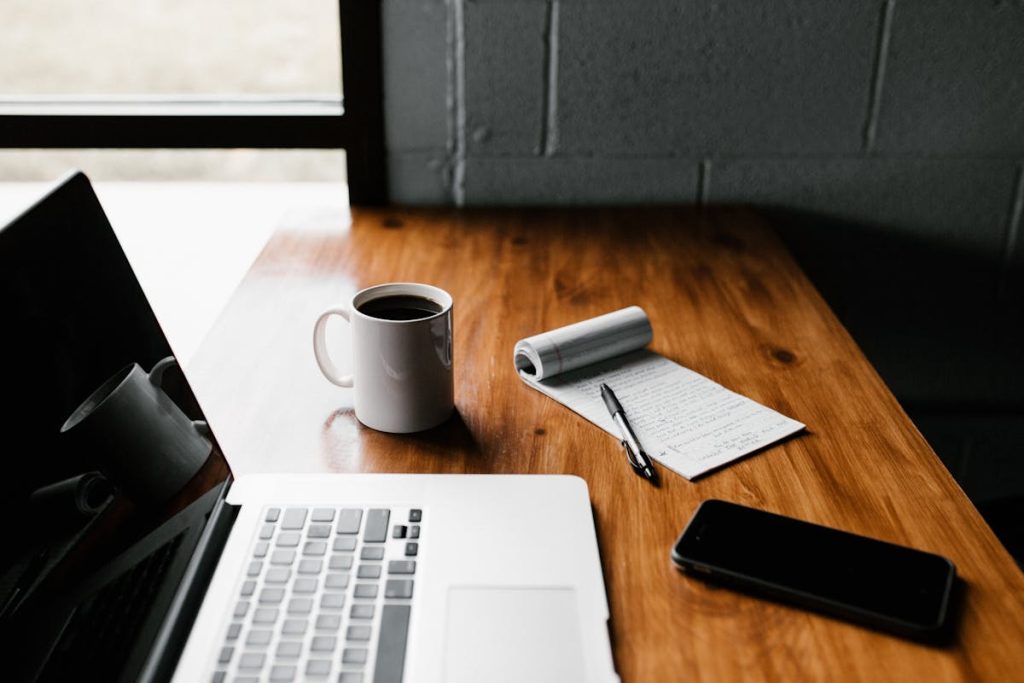 Laptop workspace for digital freelance caption creation