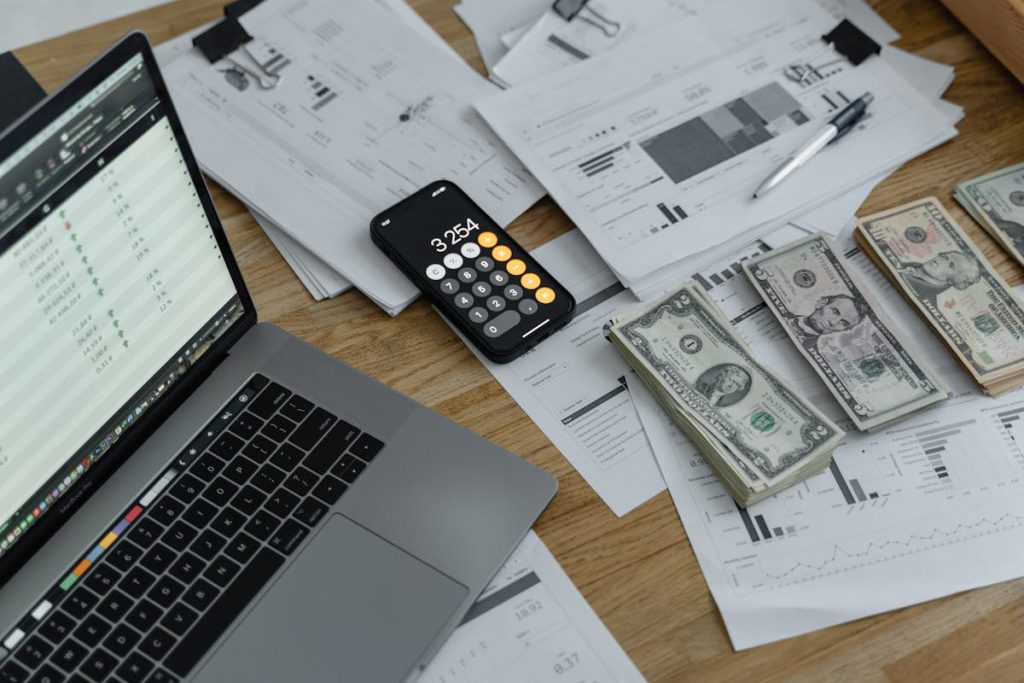 Banknotes and calculator on a table, symbolizing how to turn extra cash into income-generating opportunities
