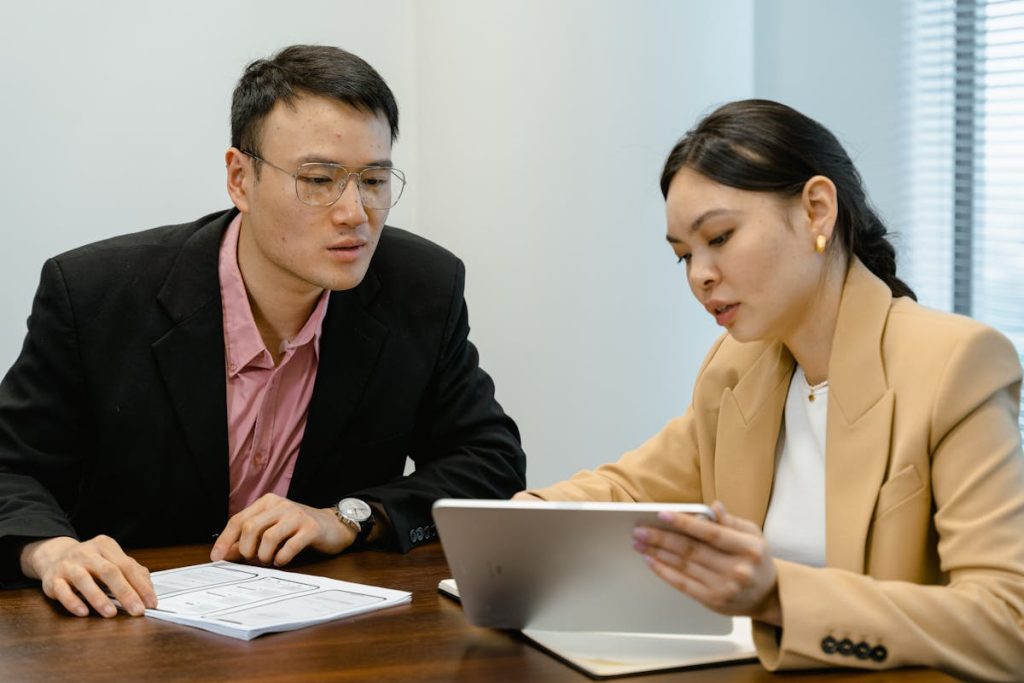 Man and woman setting an evaluation on tablet
