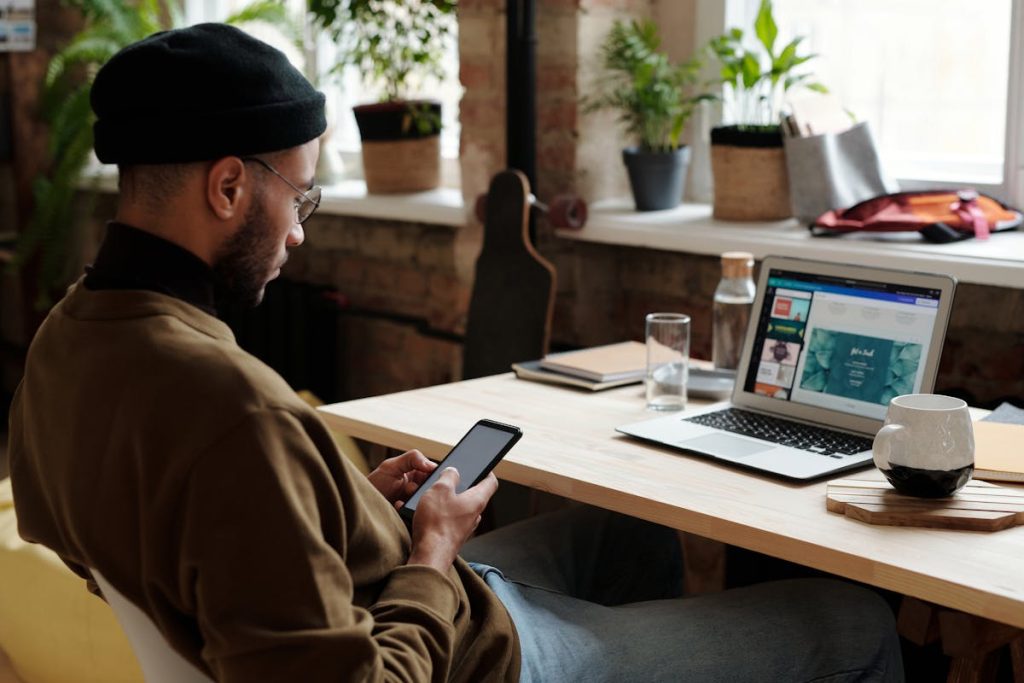 Man sitting at desk ready to start a digital side hustle