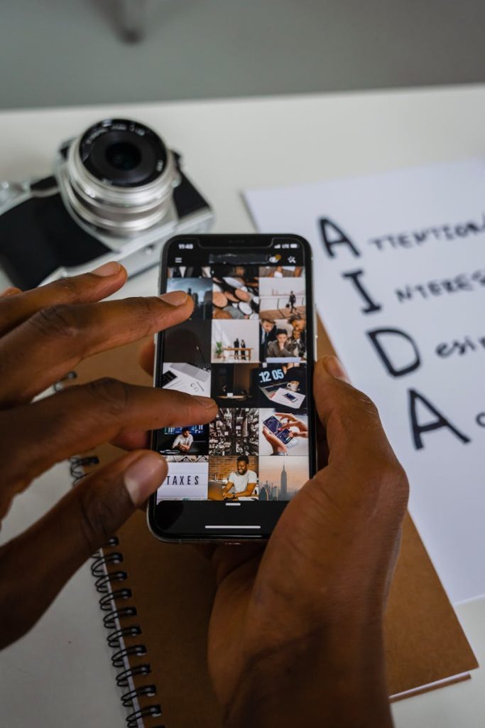 Person using smartphone with AIDA model in the background, representing caption creation tools