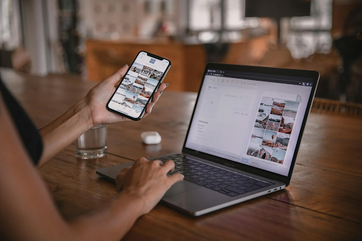 a woman at a laptop and her phone as an influencer
