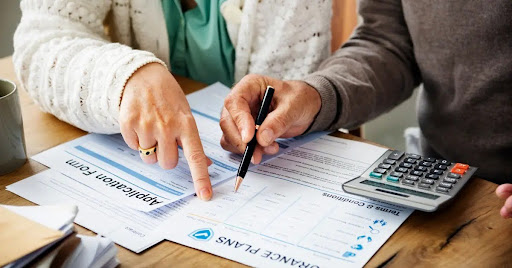 Two people obtaining retirement forms