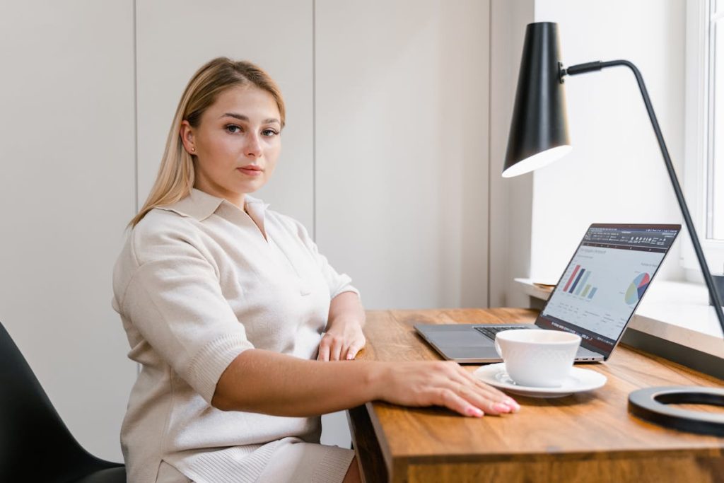 Woman reviewing statistics on a laptop, representing invisible skills powering remote income