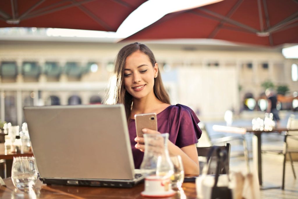 a woman texting on her phone in a restaurant