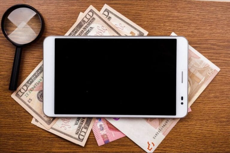 financial-analysis-tablet-magnifying-glass-money
